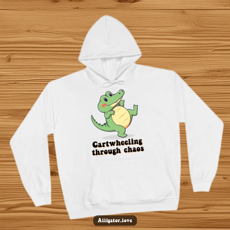 Funny alligator hoodie featuring a cute reptile doing a cartwheel with a smile, offering warmth and charm.